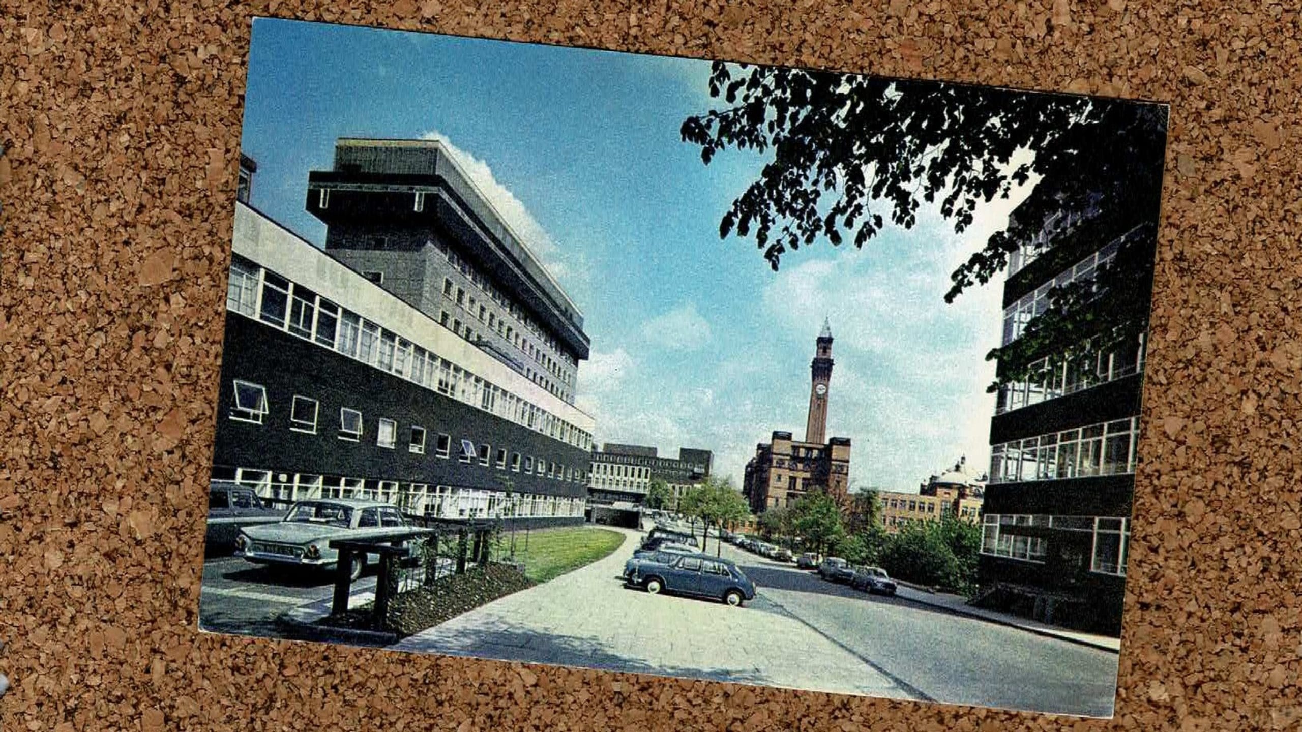 Image of a postcard of the University of Birmingham bell tower on a cork board