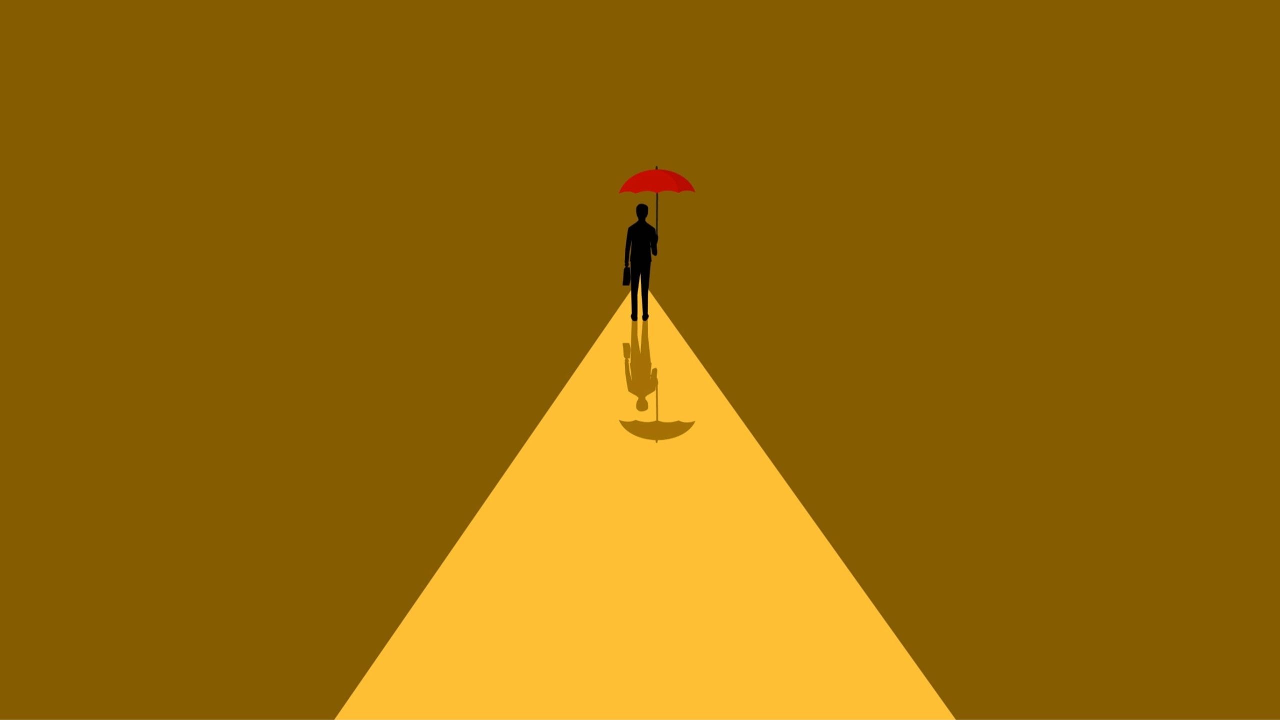 Image of a person walking alone with a red umbrella